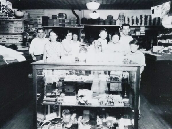 Photo of the Saidel family inside their general store at the corner of Lakeside Drive and Horicon Avenue in Bolton Landing