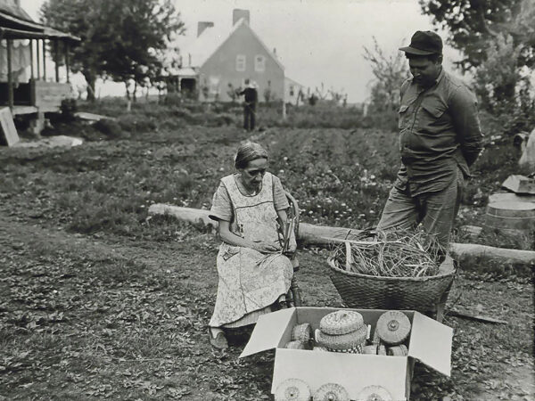 Woman weaving baskets