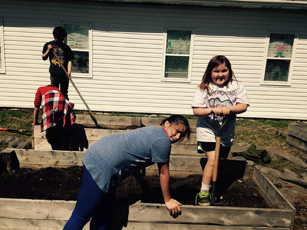 Students working on garden bed