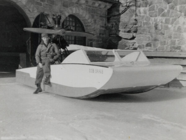 Gerald Heath sits on iceboat