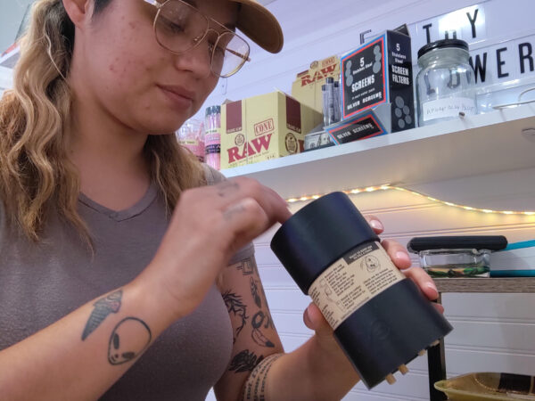 Kylee Mitchell Gibson packs cones at dispensary