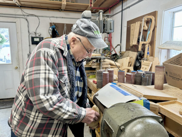 Sanding wood on a belt sanding machine